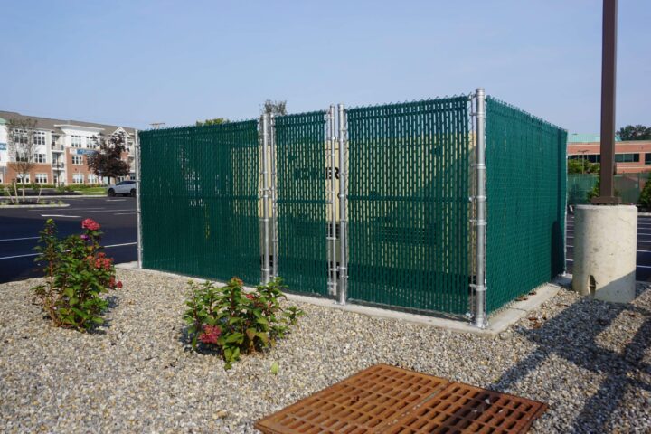 Chain Link Dumpster Enclosure With Green Slats