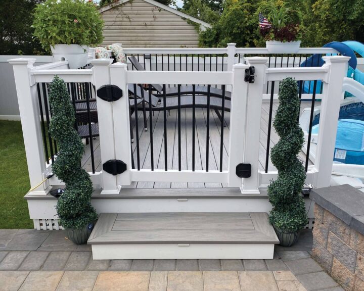 Coastal White T-Rail Vinyl Railing With Black Aluminum Spindles Gate By Above Ground Pool