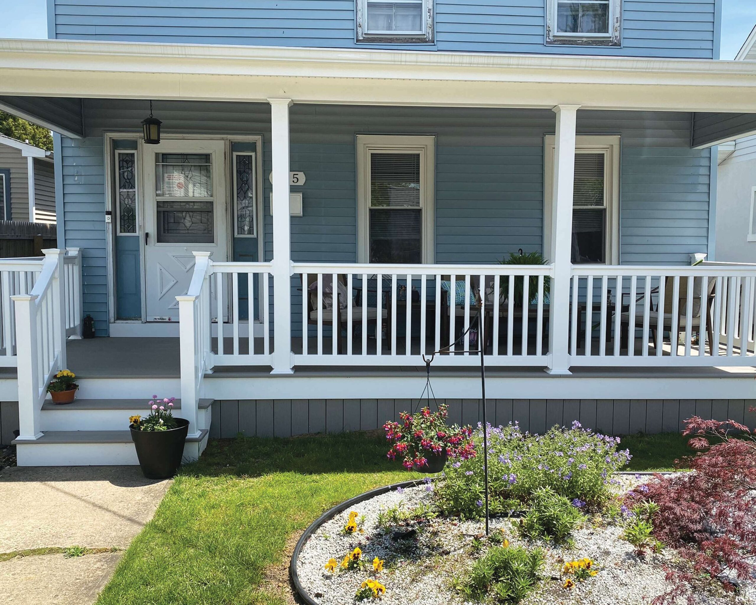 Harbor gray porch and facing with White T-Rail Vinyl Railing